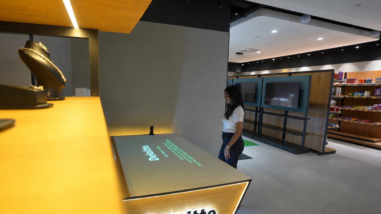 Deloitte interactive table display inside a modern retail experience centre